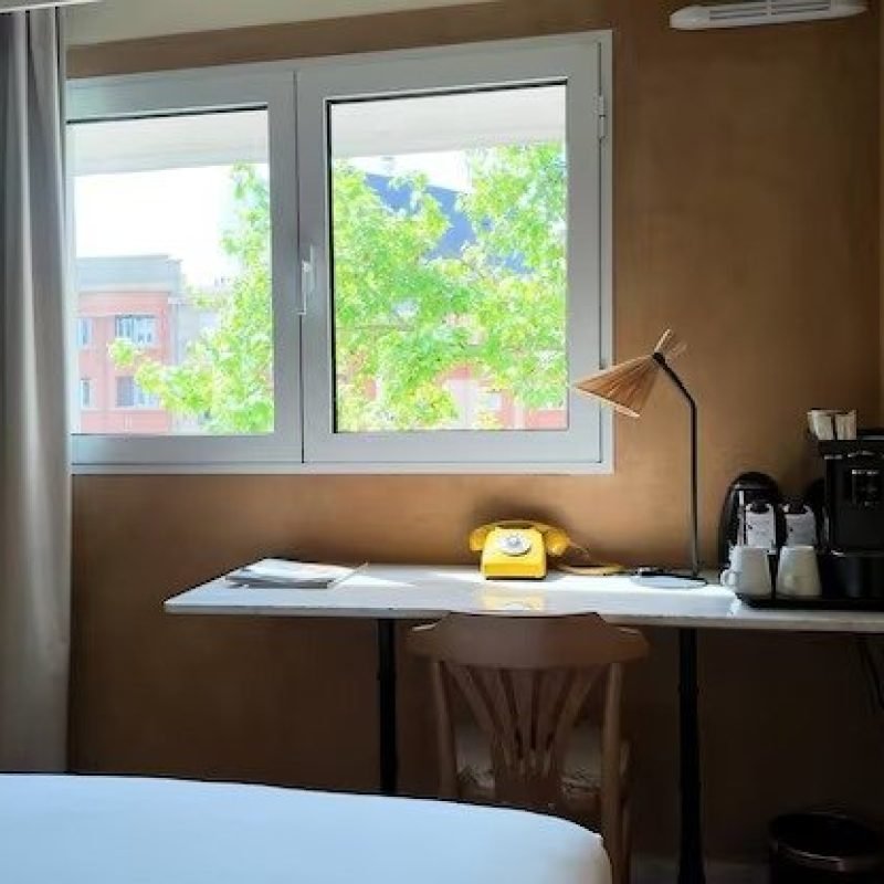 imgi_5_elegant-parisian-boutique-hotel-room-with-vintage-yellow-rotary-phone_1308-190376
